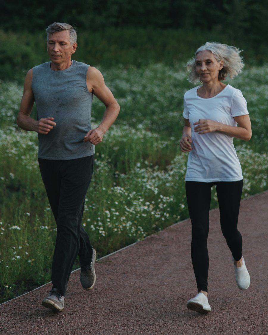 An older couple jogging together